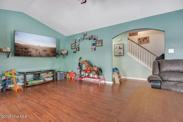 rec room featuring hardwood / wood-style flooring and vaulted ceiling