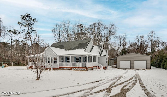 view of front of home with a garage, an outdoor structure, and covered porch