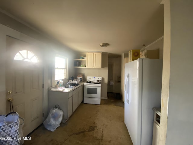 kitchen featuring sink, white appliances, and white cabinets