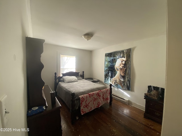 bedroom featuring dark wood-type flooring and a baseboard radiator