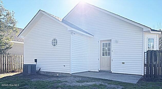 back of house with a patio and cooling unit