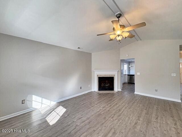 unfurnished living room featuring ceiling fan, lofted ceiling, and hardwood / wood-style floors