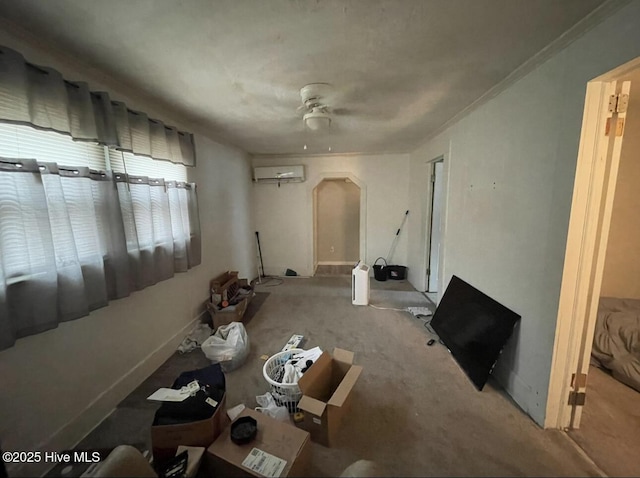 interior space with a wall mounted AC and ceiling fan