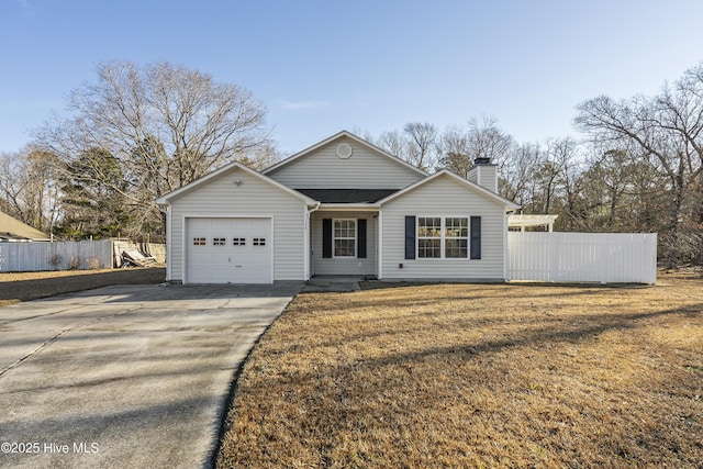 view of front of home featuring a garage and a front yard