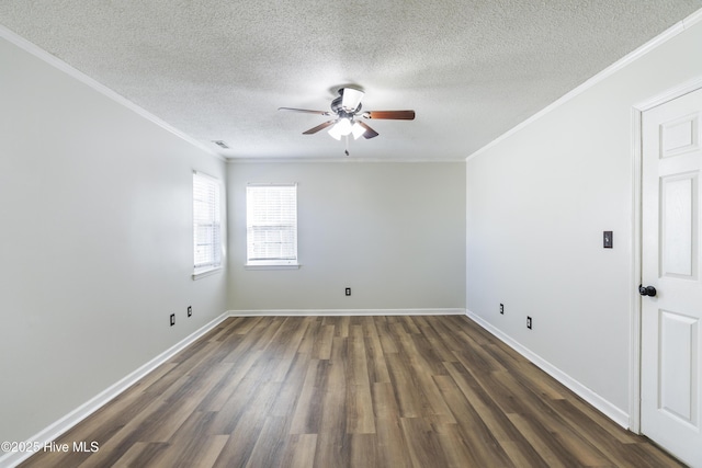 empty room featuring ornamental molding, dark hardwood / wood-style floors, a textured ceiling, and ceiling fan