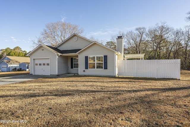 view of front of house with a garage and a front yard