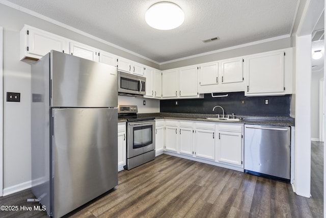 kitchen featuring sink, stainless steel appliances, and white cabinets