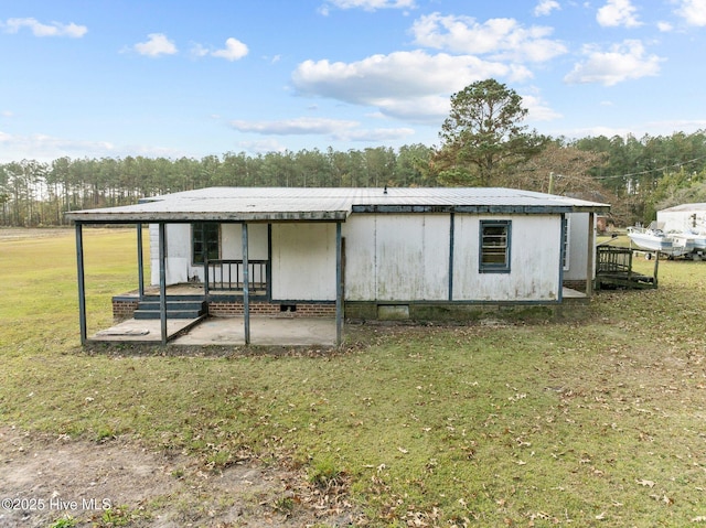 view of outbuilding with a yard