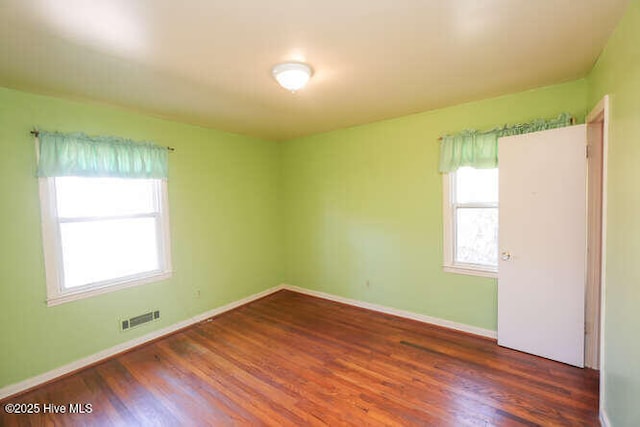 161 Willetts Dr, Boiling Spring Lakes, NC 28461 - spare room with healthy amount of natural light, wood finished floors, and baseboards