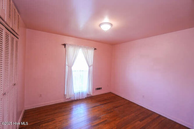 161 Willetts Dr, Boiling Spring Lakes, NC 28461 - spare room featuring dark wood finished floors and baseboards