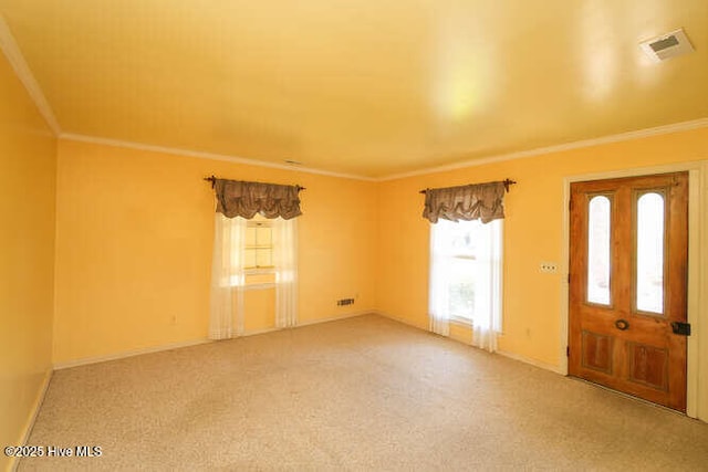 161 Willetts Dr, Boiling Spring Lakes, NC 28461 - entrance foyer with healthy amount of natural light, light carpet, and ornamental molding