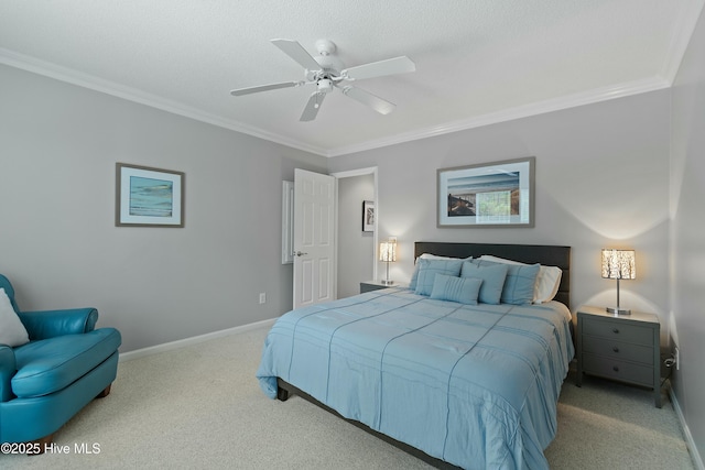 carpeted bedroom featuring ornamental molding, a textured ceiling, and ceiling fan