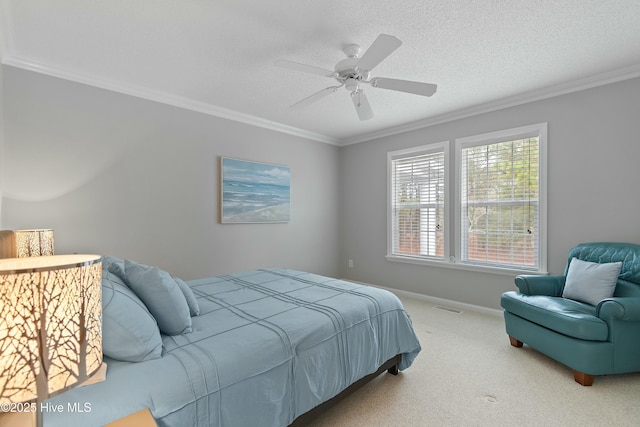 bedroom featuring crown molding, ceiling fan, carpet floors, and a textured ceiling