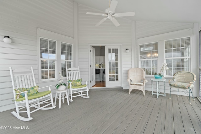 wooden terrace with ceiling fan and a porch