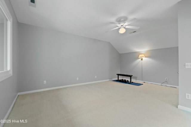 bonus room featuring lofted ceiling, carpet flooring, and ceiling fan