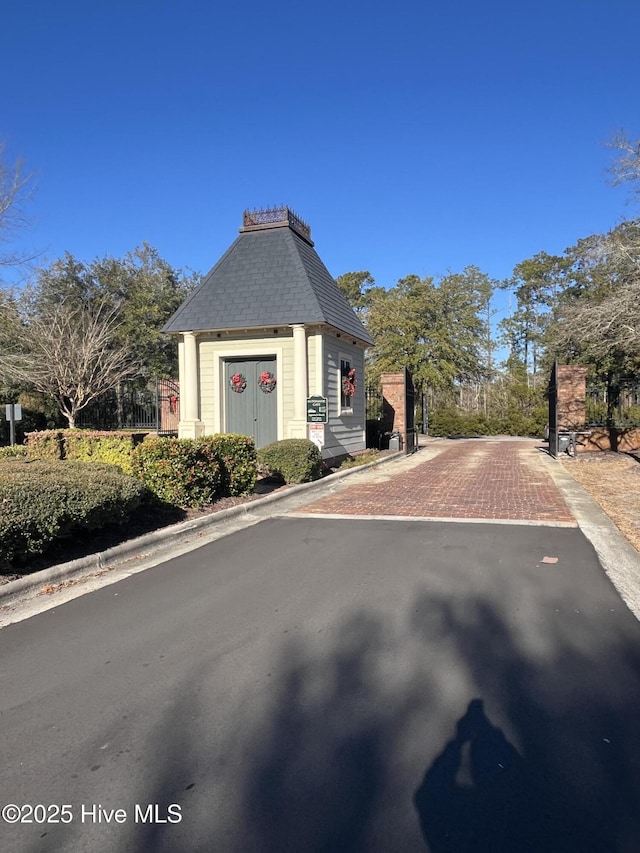 view of front of house with a shingled roof