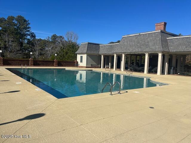 view of swimming pool with fence, a patio, and a fenced in pool