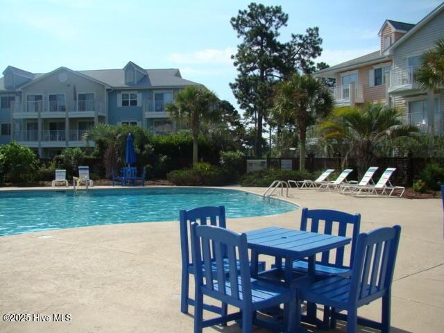 view of pool with a patio area