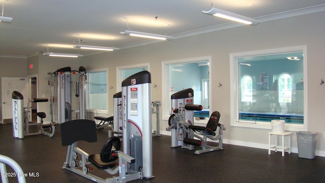 gym featuring crown molding