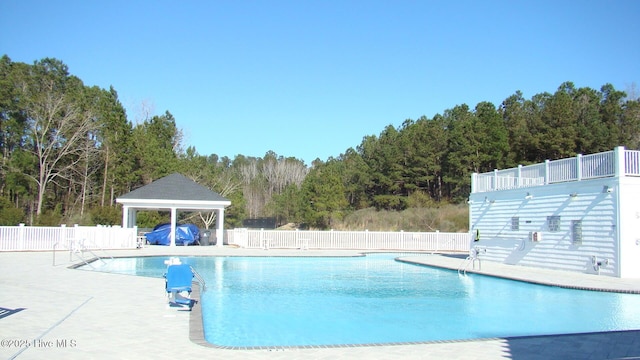 view of swimming pool with a gazebo