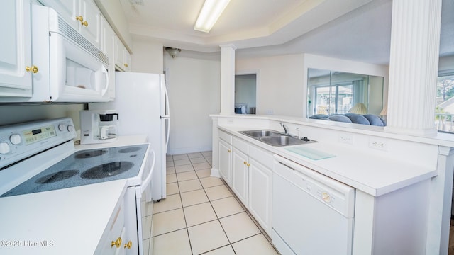 kitchen featuring sink, white appliances, and white cabinets