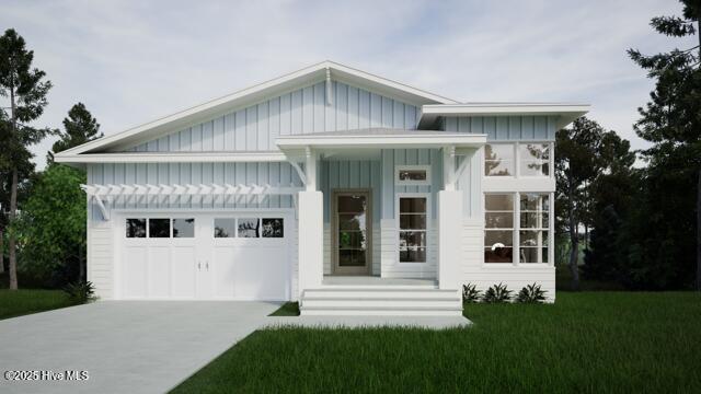 view of front of home with a garage and a front yard