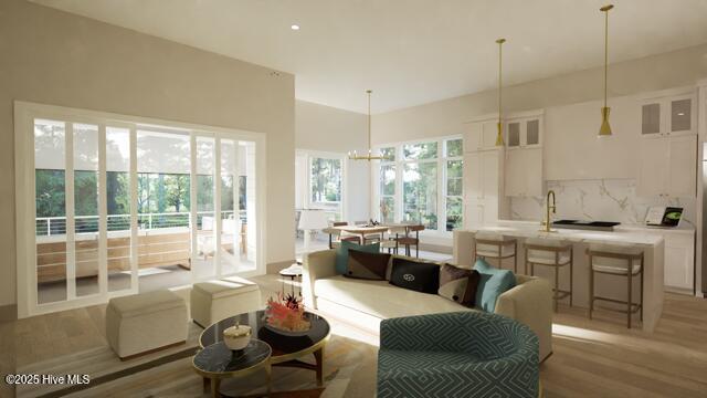 living room featuring hardwood / wood-style flooring and an inviting chandelier