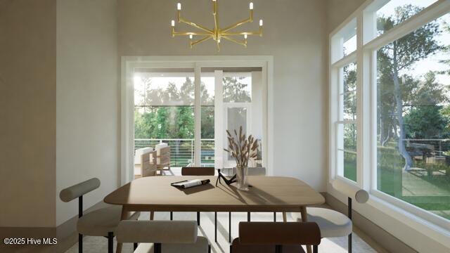 dining space with an inviting chandelier