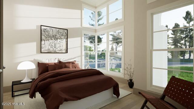 bedroom featuring multiple windows and wood-type flooring