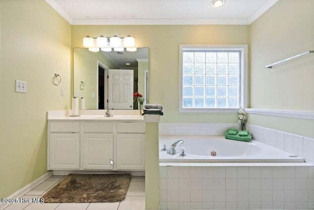 bathroom featuring tiled tub, crown molding, vanity, and tile patterned floors