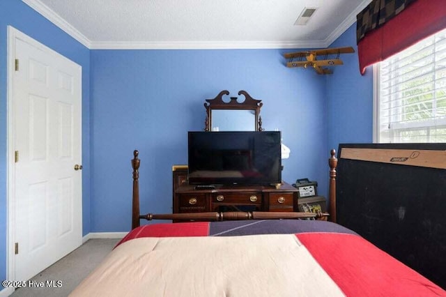 bedroom featuring ornamental molding and carpet