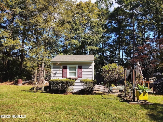 bungalow-style house featuring a front yard