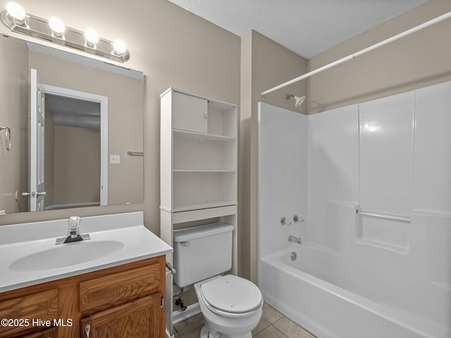 full bathroom with shower / bathing tub combination, vanity, toilet, tile patterned floors, and a textured ceiling