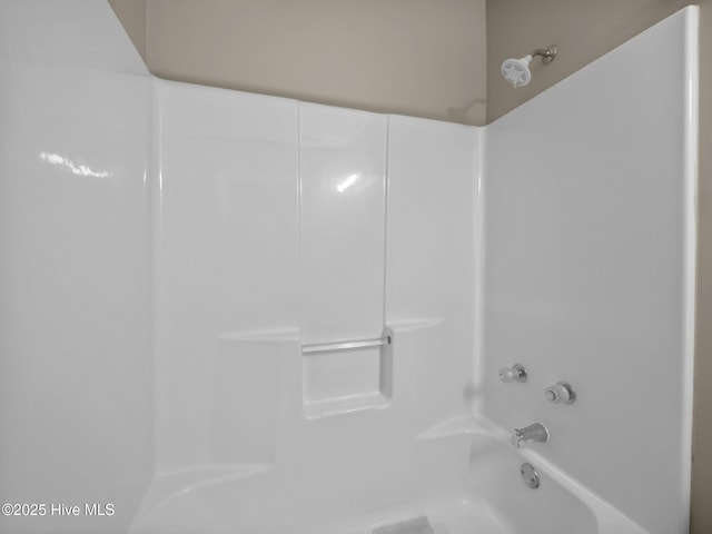 bathroom with shower / washtub combination