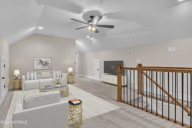 carpeted living room with a ceiling fan, baseboards, vaulted ceiling, and visible vents