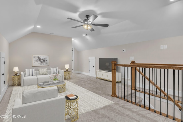 carpeted living area with visible vents, baseboards, lofted ceiling, and a ceiling fan