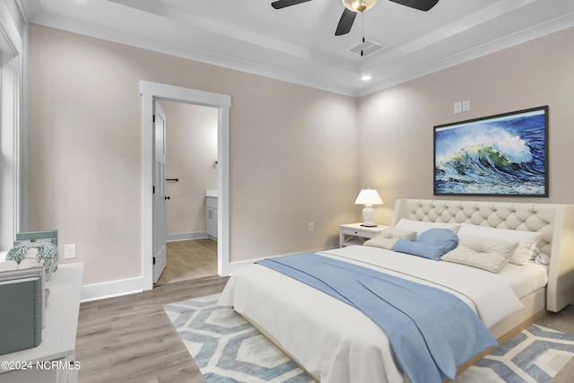 bedroom with visible vents, crown molding, baseboards, wood finished floors, and recessed lighting