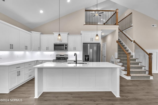 kitchen featuring a notable chandelier, light countertops, appliances with stainless steel finishes, and white cabinets