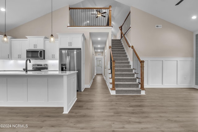 kitchen featuring visible vents, light countertops, appliances with stainless steel finishes, white cabinetry, and a ceiling fan