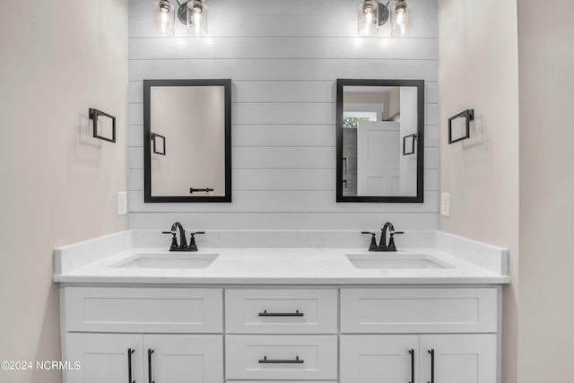 bathroom with double vanity and a sink