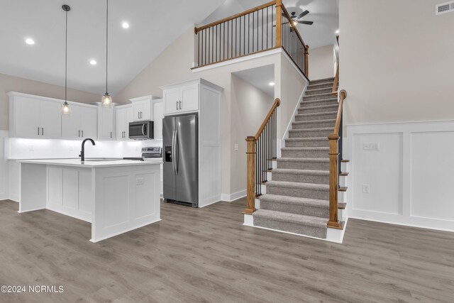laundry room featuring washer hookup, gas dryer hookup, visible vents, and wood finished floors