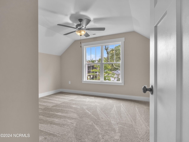 bonus room with ceiling fan, baseboards, carpet, and vaulted ceiling