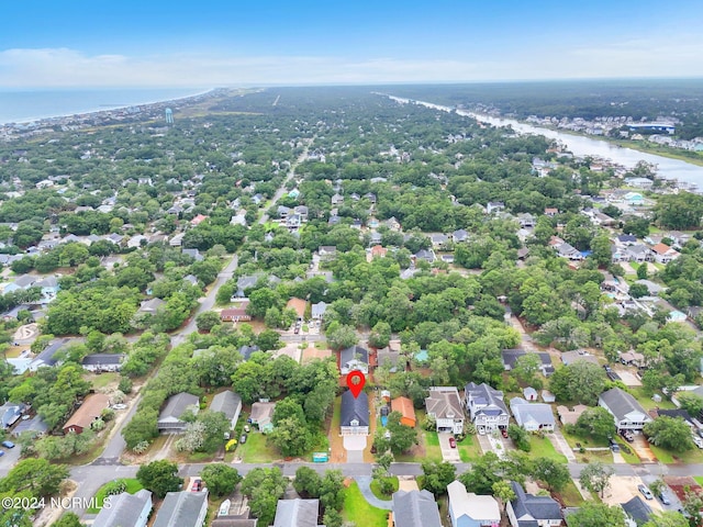 drone / aerial view with a water view and a residential view