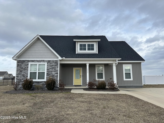 view of front of home with a front lawn and a porch