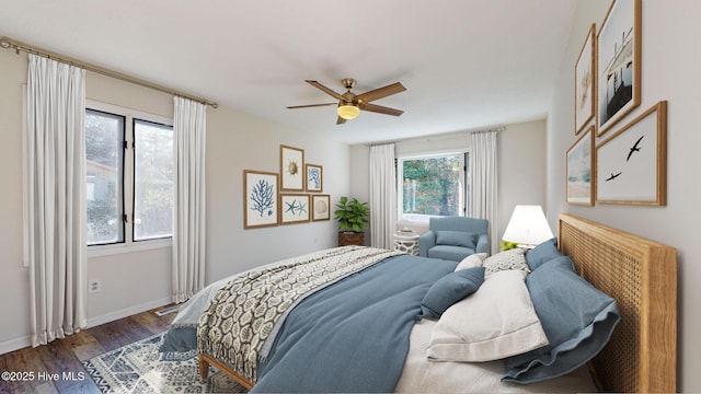 bedroom featuring ceiling fan and dark hardwood / wood-style flooring