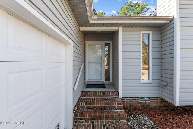 property entrance with a garage