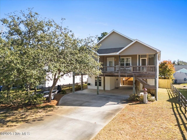 view of front of property featuring a porch and a carport