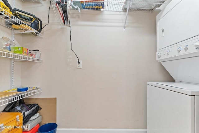 laundry area with stacked washer / dryer