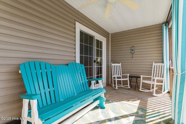 wooden deck with ceiling fan