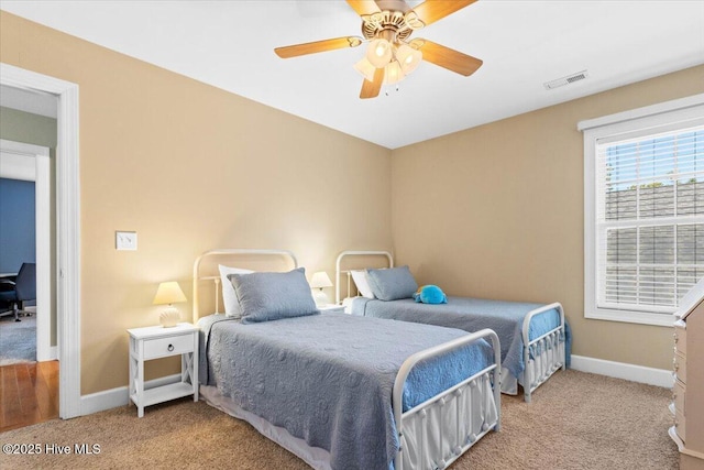 carpeted bedroom with ceiling fan